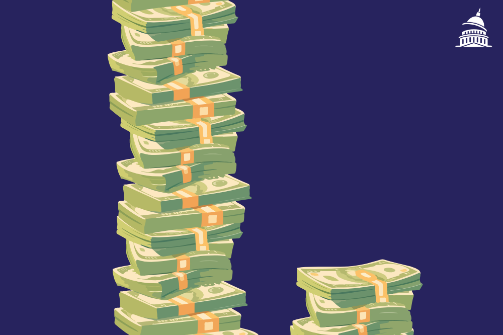 a large stack of dollars next to a small stack
