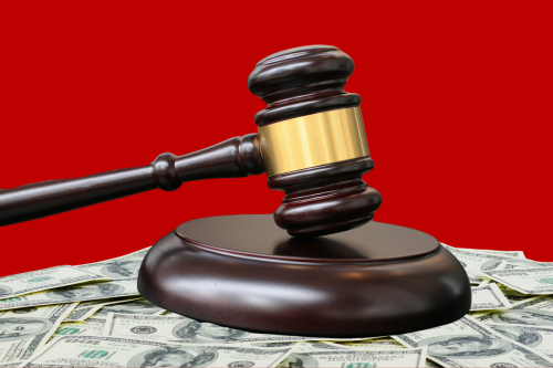 A gavel sitting on money