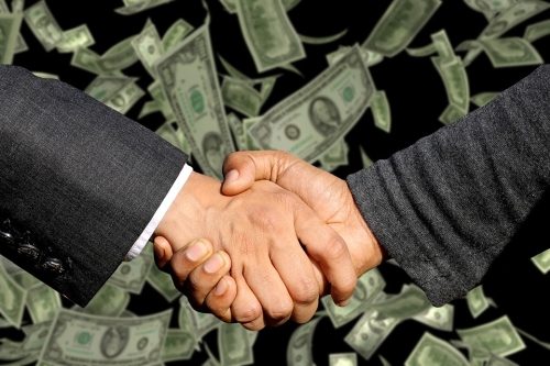 Hands Shaking Before Falling Dollars