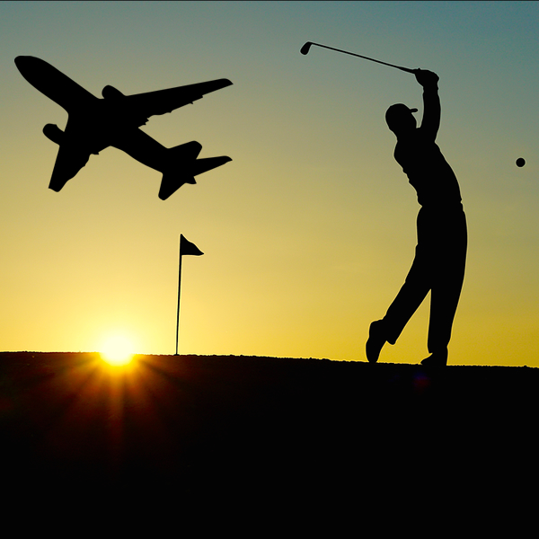 Golfer with Plane in Background