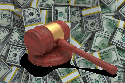 Gavel on a layer of cash