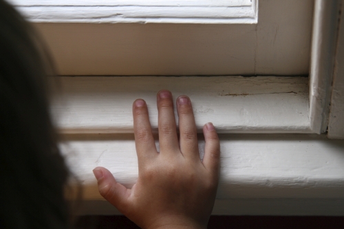 Child at Window Sill with Old Paint