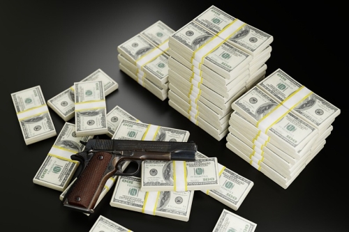 Pistol with Stacks of Cash
