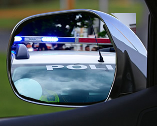Police Car in Side View Mirror