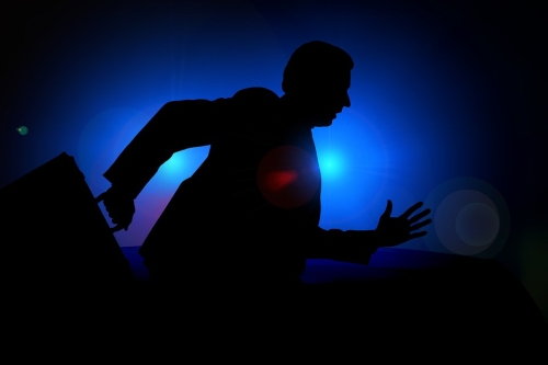Silhouette of man with briefcase